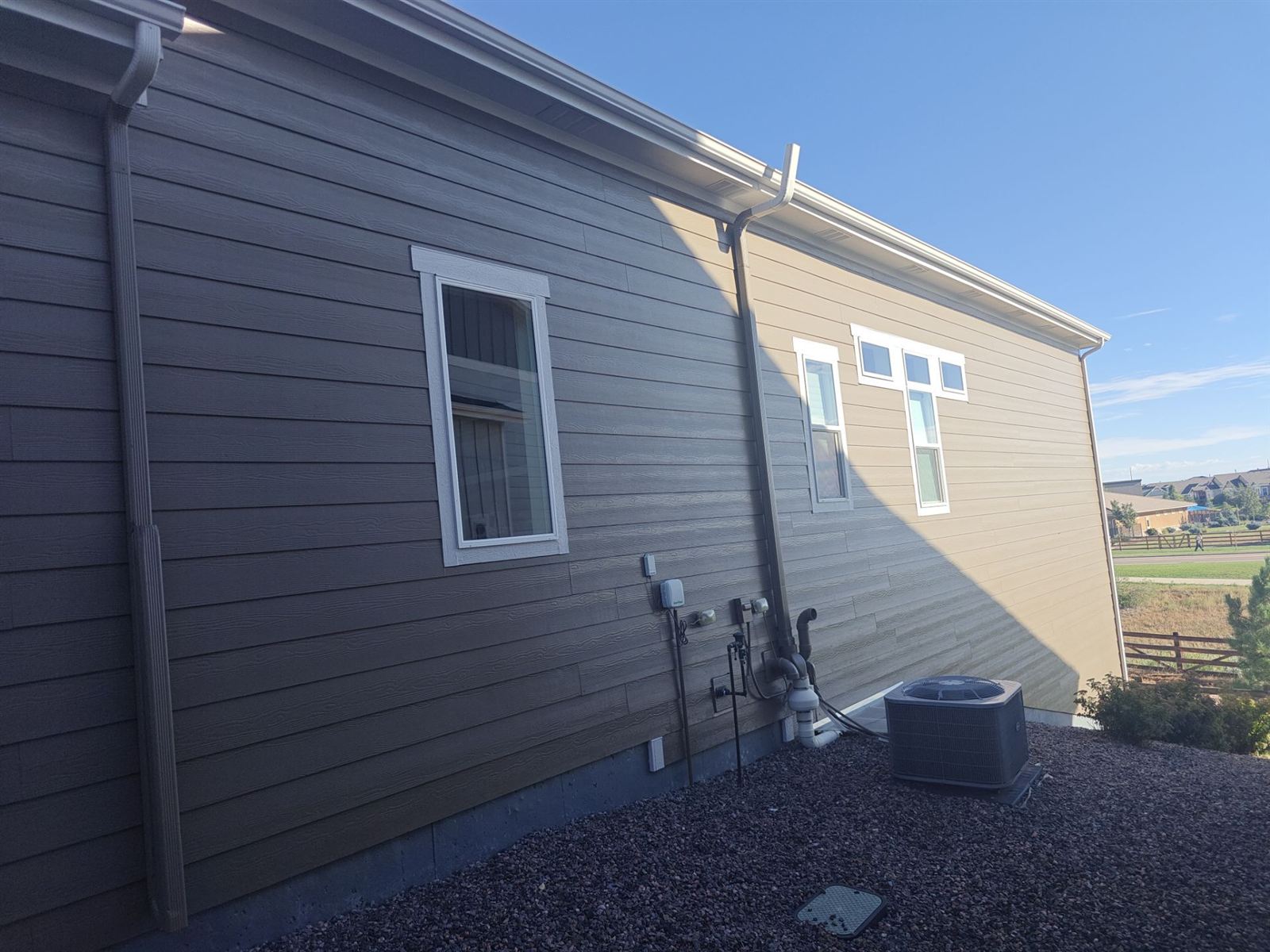 Finished exterior siding paint job on a home in Arvada, Colorado
