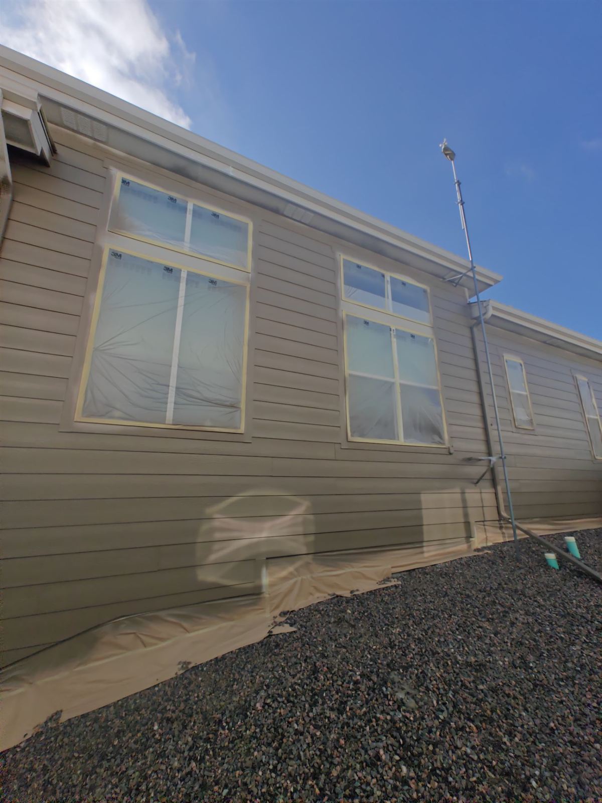 House siding repainted with a full color change in Arvada, Colorado